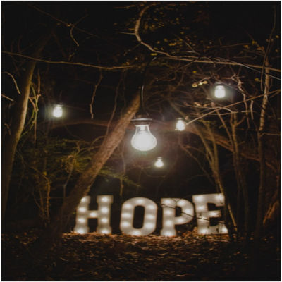 A lit sign spelling the word hope