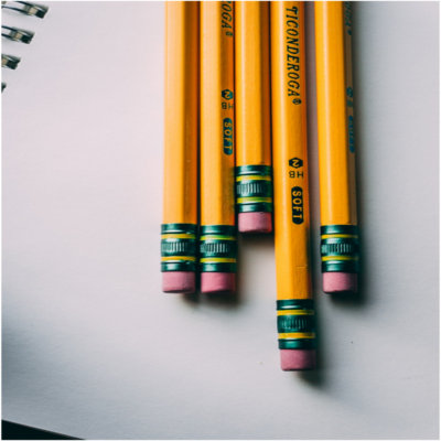 Pencils sitting on a notebook