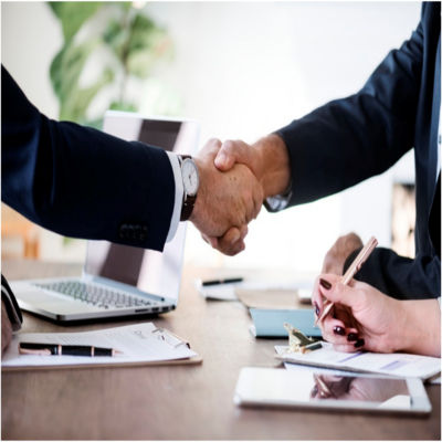 People shaking hands at a business meeting