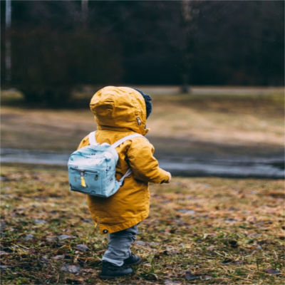 A child wearing a backpack