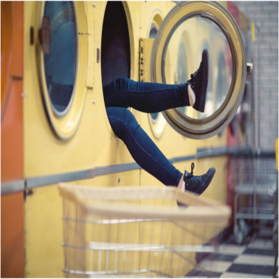 A person inside a public washing machine