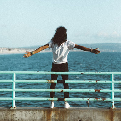 A person standing on a bridge