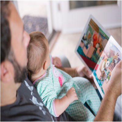 A man reading to a child