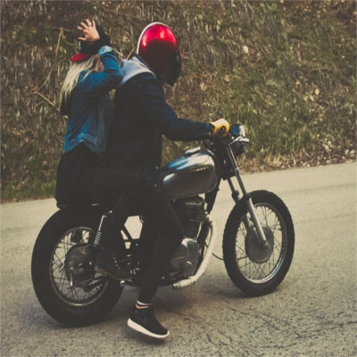 Two people on a motorcycle