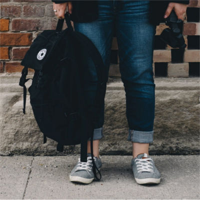 A person holding a backpack