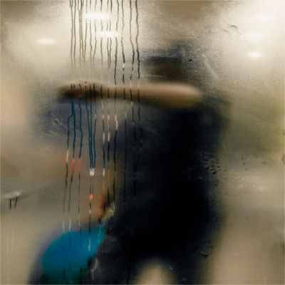 A person cleaning a shower