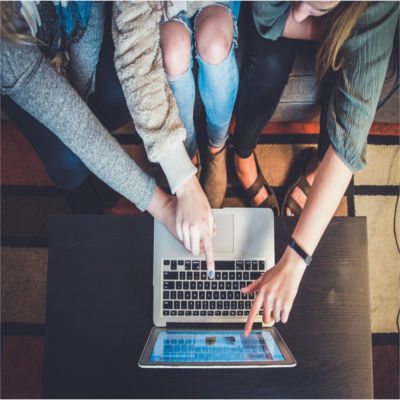 People pointing at a laptop screen