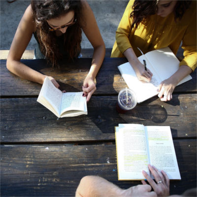 Youth reading and writing together